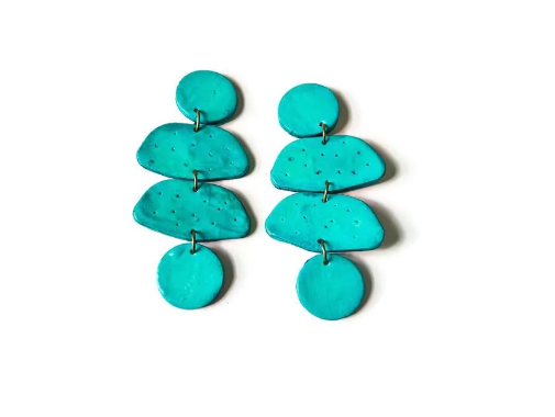 Turquoise layered earrings on a white background