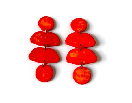 Red-orange statement earrings with stacked teardrop drops and round top posts