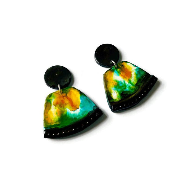 Tie-dye earrings with black accents on a white background