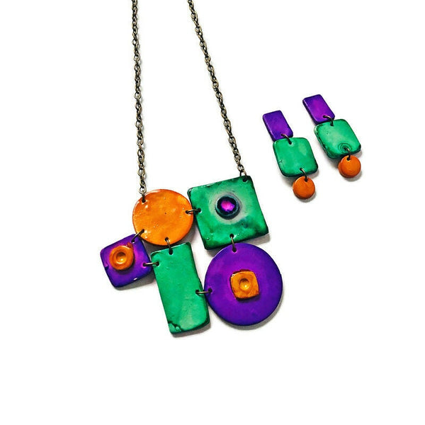 Colorful necklace with square and round pendants on a white background