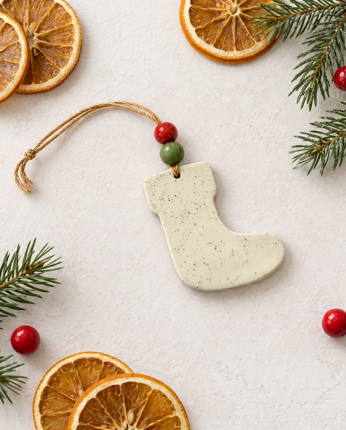 Handmade clay Christmas stocking ornament, speckled cream with twine loop and bead top