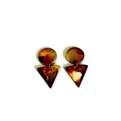 Pair of earrings with circular and triangular brown and gold pieces on a white background