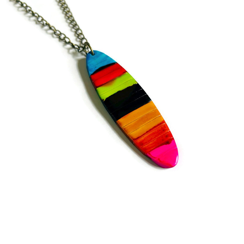 Necklace with a multicolored striped pendant on a white background
