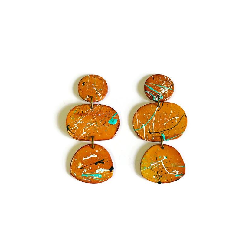 Pair of mustard yellow earrings with paint splashes 
