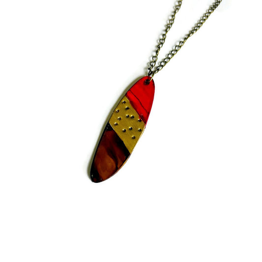 Necklace with a colorful pendant on a white background