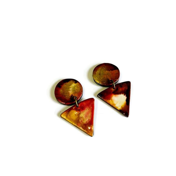 Pair of earrings with tortoiseshell-like finish on a white background