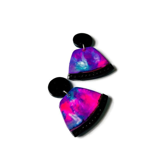 Colorful abstract earrings on a white background
