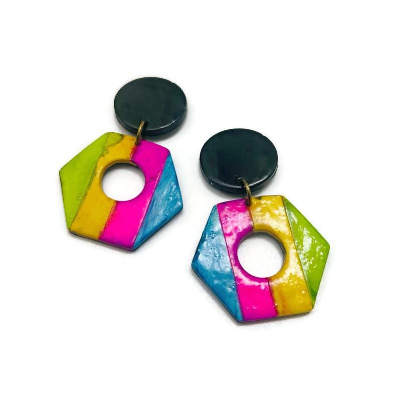 Colorful geometric earrings with black posts on a white background