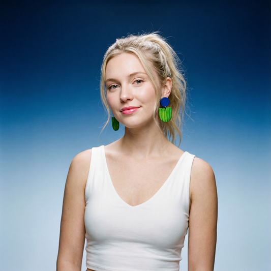 Woman wearing colorful earrings against a blue gradient background