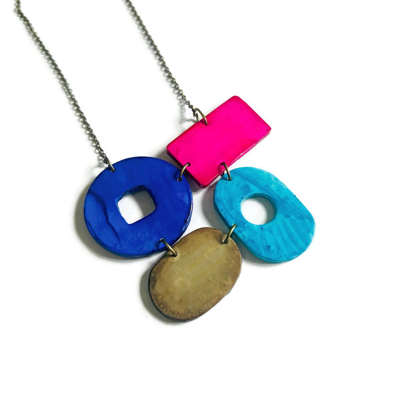 Necklace with colorful pendant on a white background