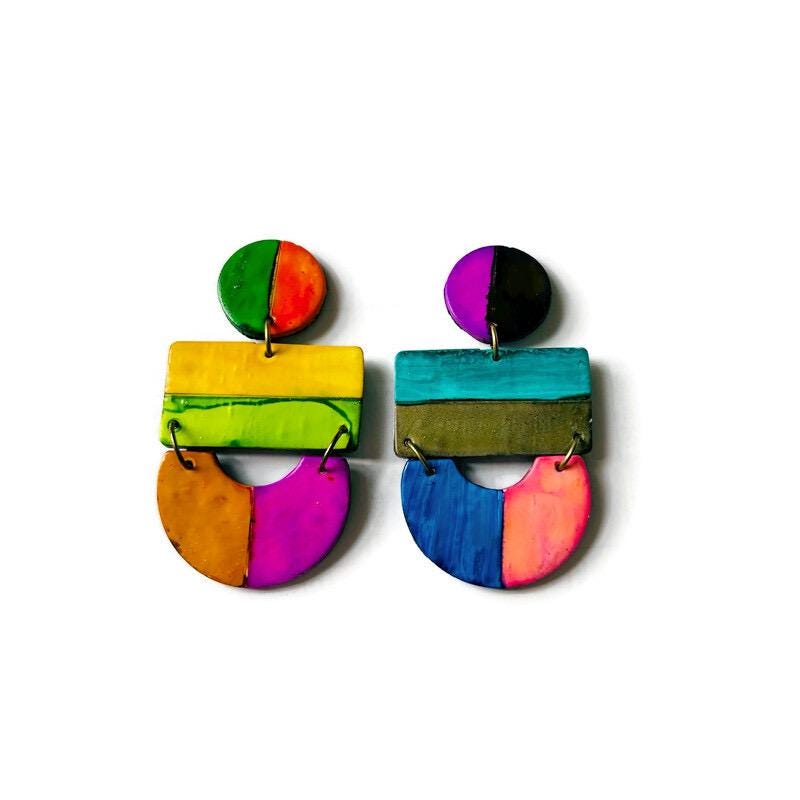 Colorful geometric earrings on a white background