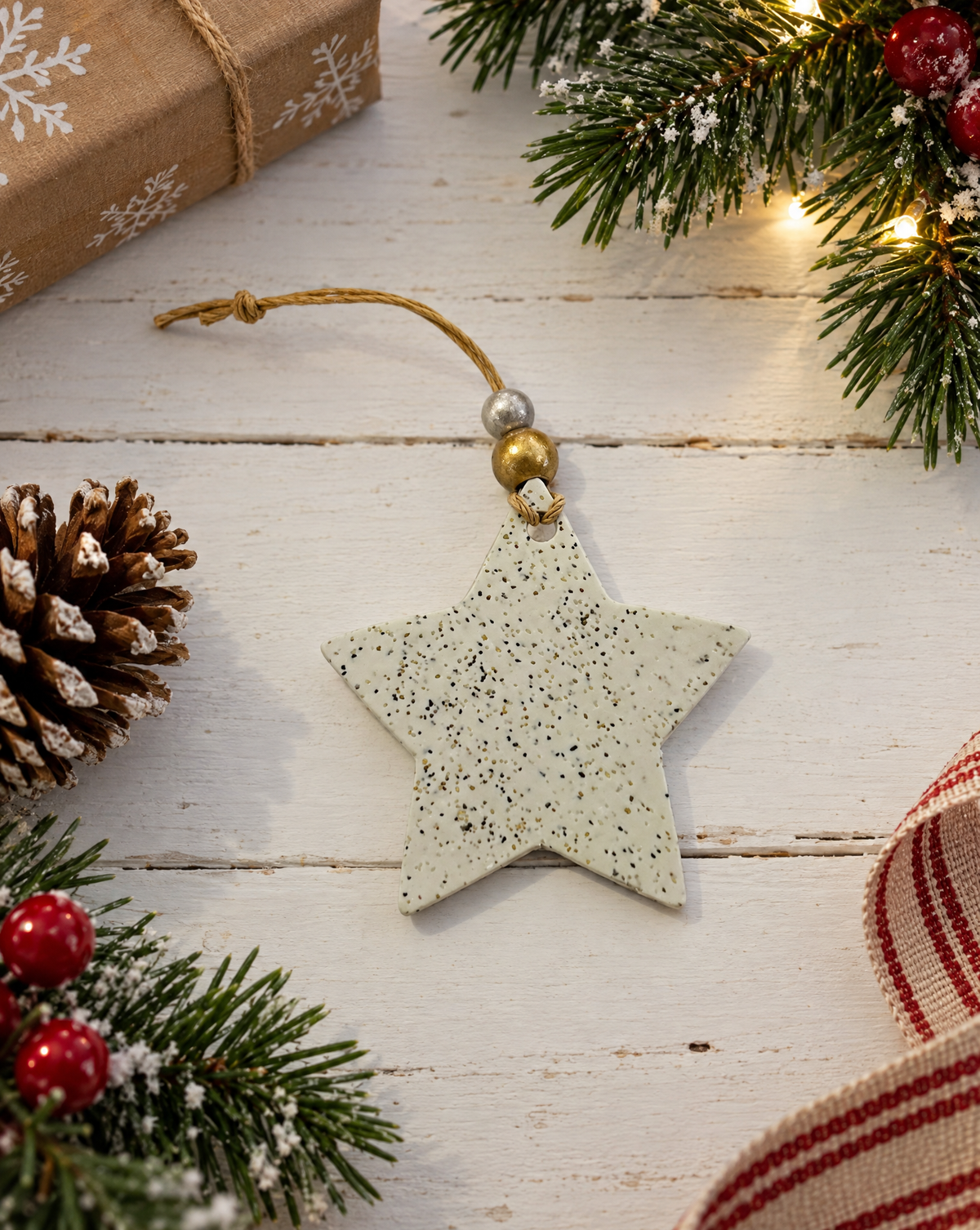 Handmade star Christmas ornament, speckled star with gold bead cap and hanging string.