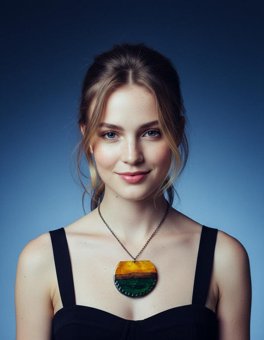 Woman wearing a black dress with a colorful pendant necklace against a blue background