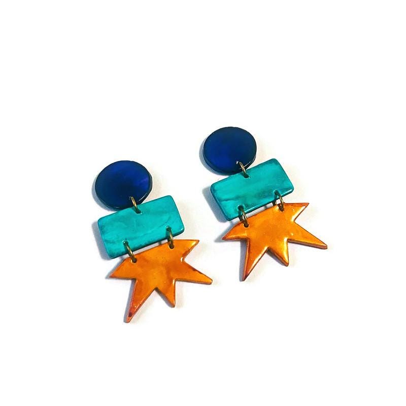 Geometric star drop earrings: dark blue circles, teal rectangles, orange star charms