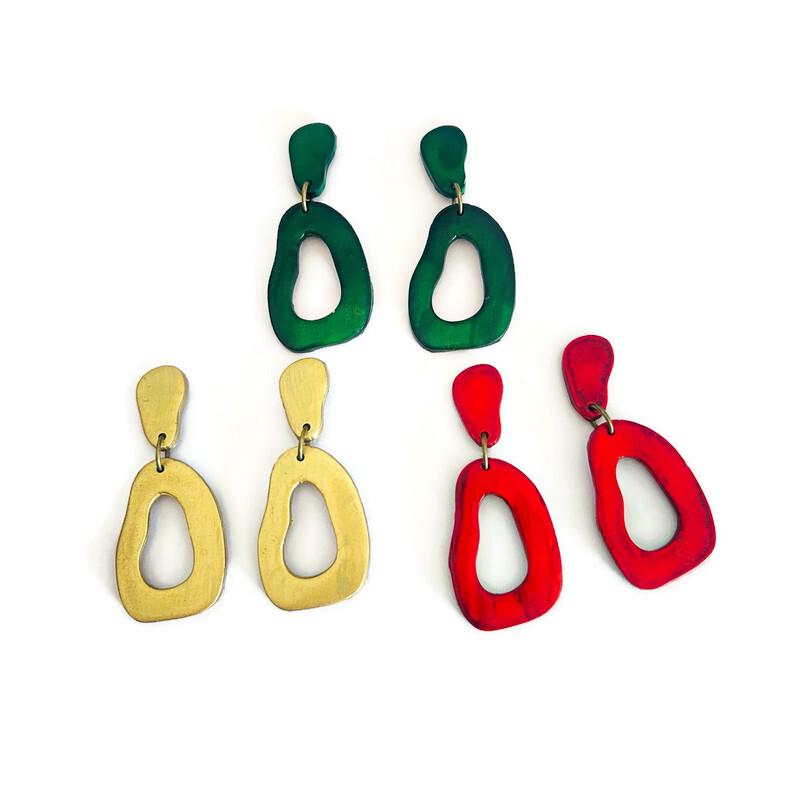 Assorted teardrop drop earrings in green, red, and gold with gold hooks