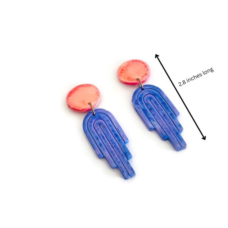 Long polymer clay dangle earrings with pink round tops and blue arch drops