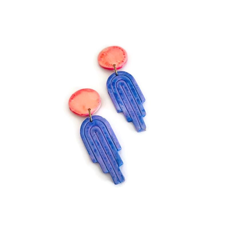 Polymer clay dangle earrings with pink round tops and blue vertical arched pieces