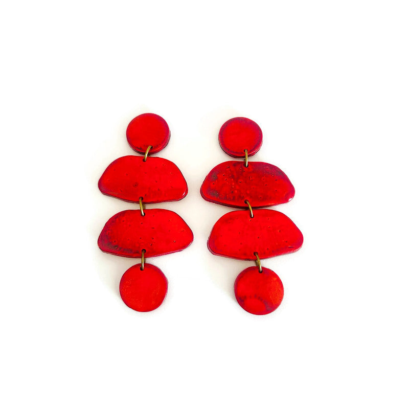 Red polymer clay layered dangle post earrings with three teardrop tiers