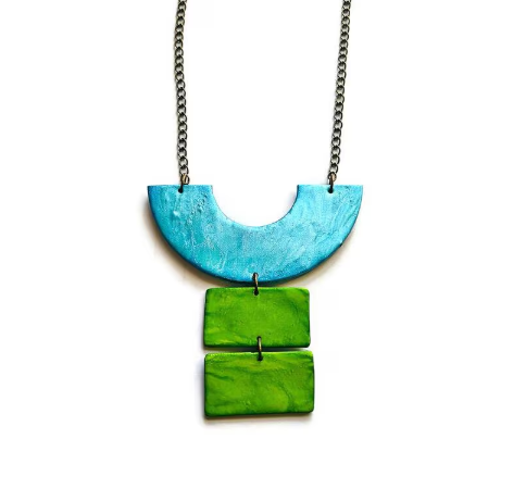 Necklace with a blue and green pendant on a white background