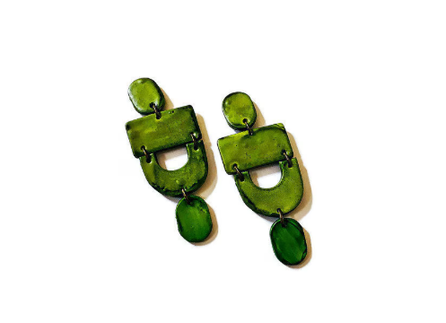 Green earrings on a white background