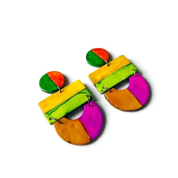 Colorful earrings with a geometric design on a white background