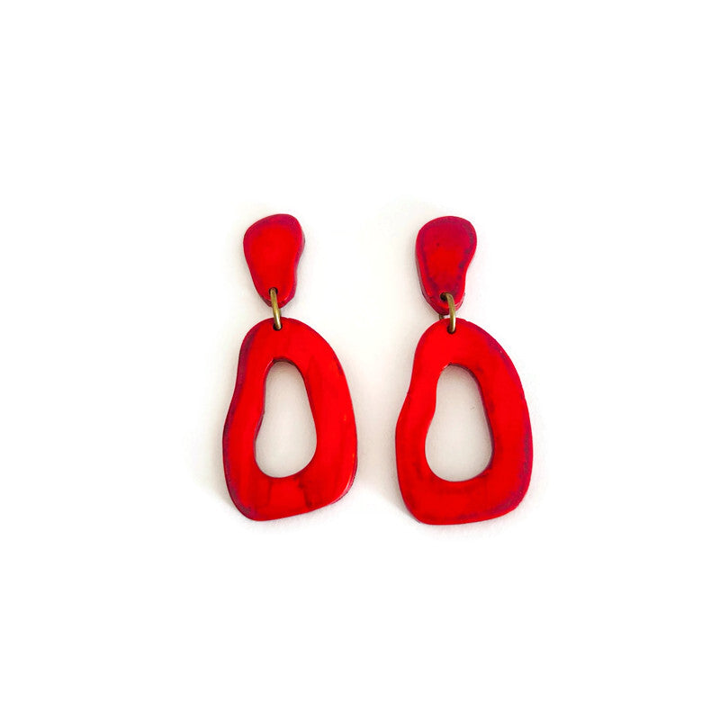 Red organic hoop earrings with gold post backs and teardrop cutout