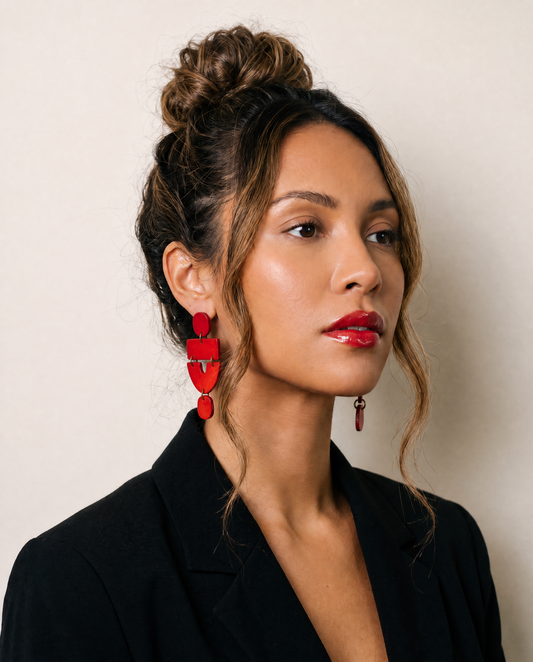 Red clip-on statement earrings with layered drops and small hanging charm