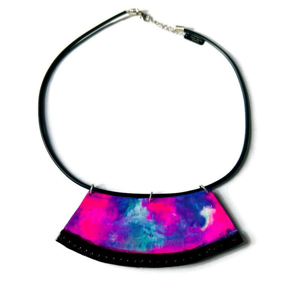 Necklace with a colorful, semi-circular pendant on a white background