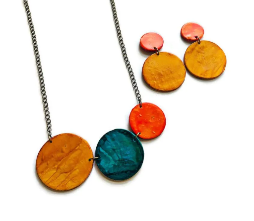 Necklace with colorful circular pendants on a white background