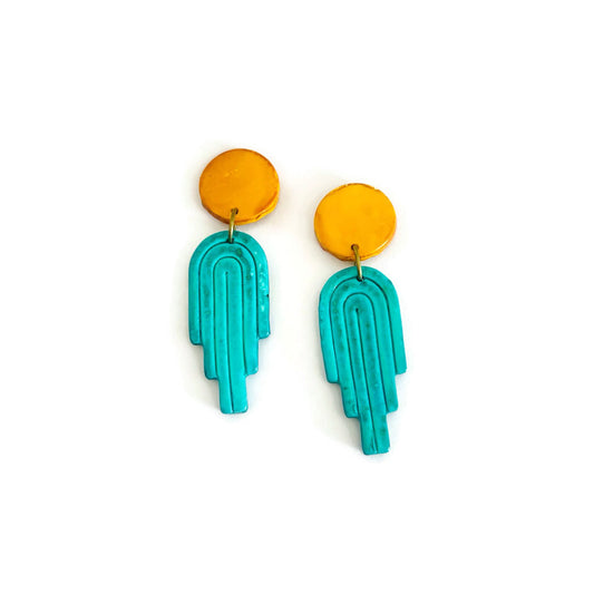 Polymer clay dangle earrings with yellow round tops and teal arch-shaped drops