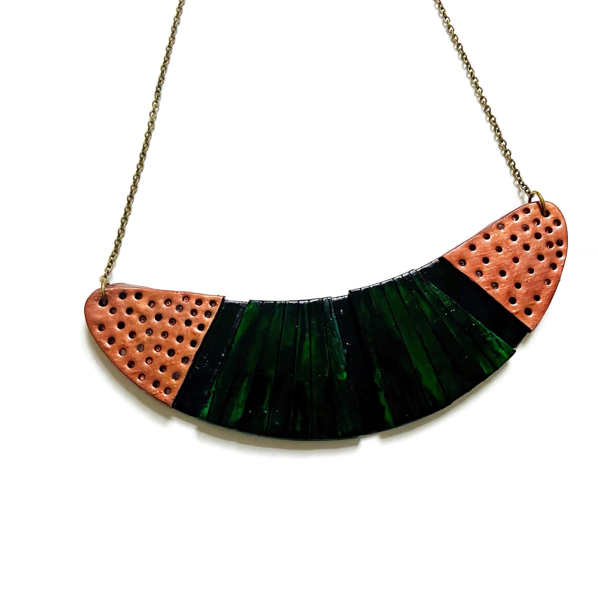 Crescent pendant necklace with orange-speckled ends and deep emerald green striped center